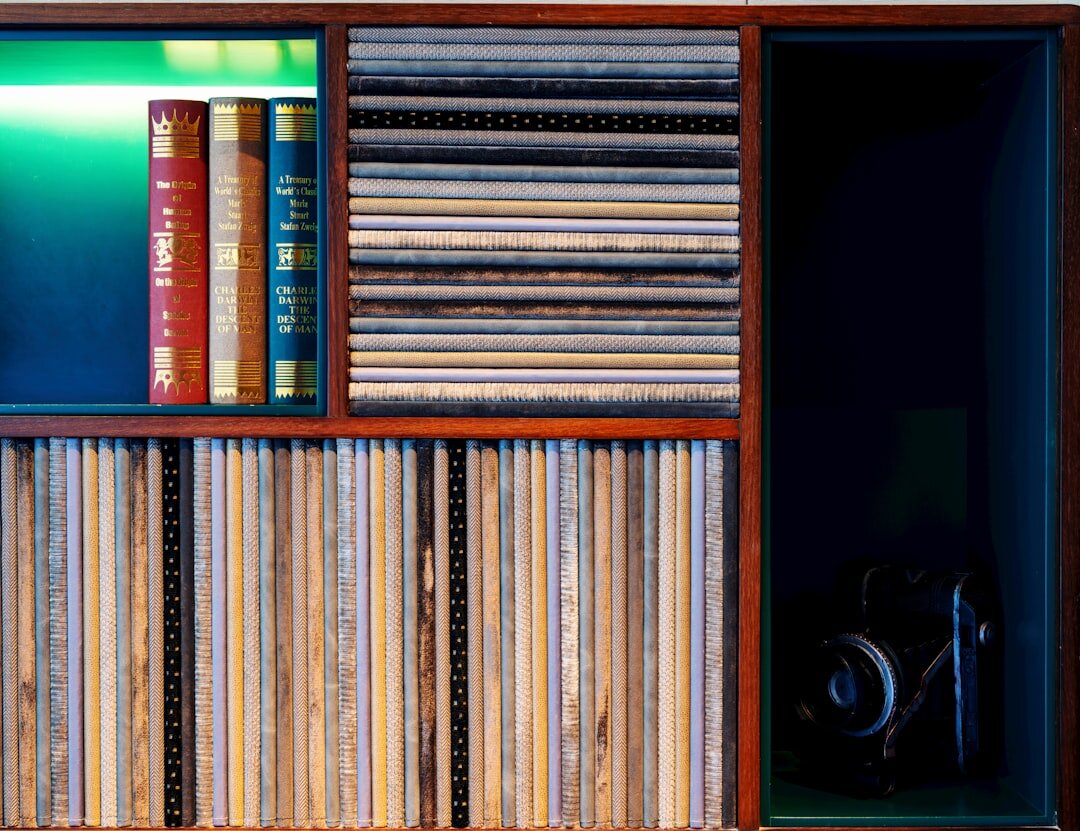 Archive film reels and videotapes on a shelf